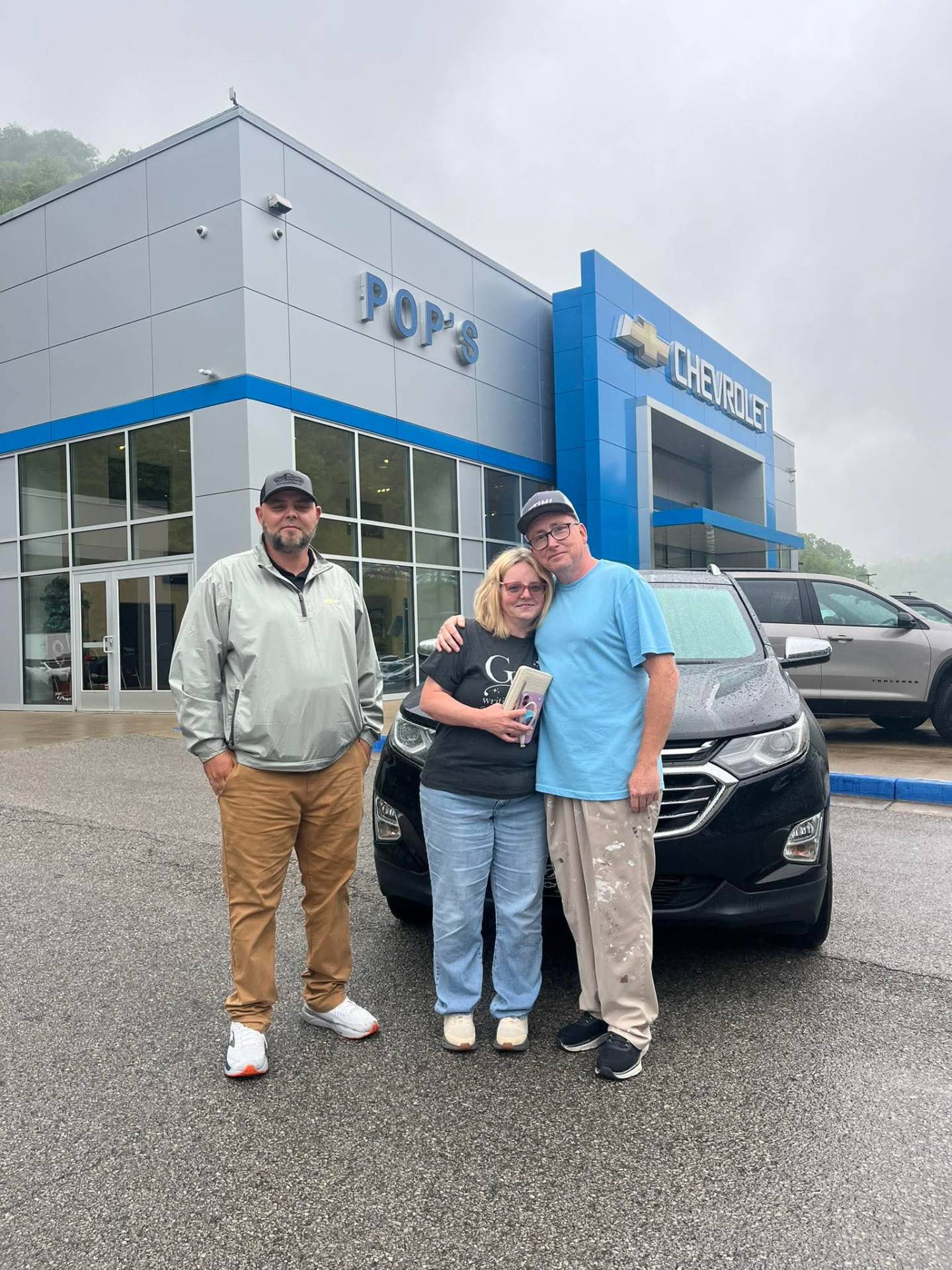 Happy customer taking delivery at Pop Chevrolet with Nathan Hall