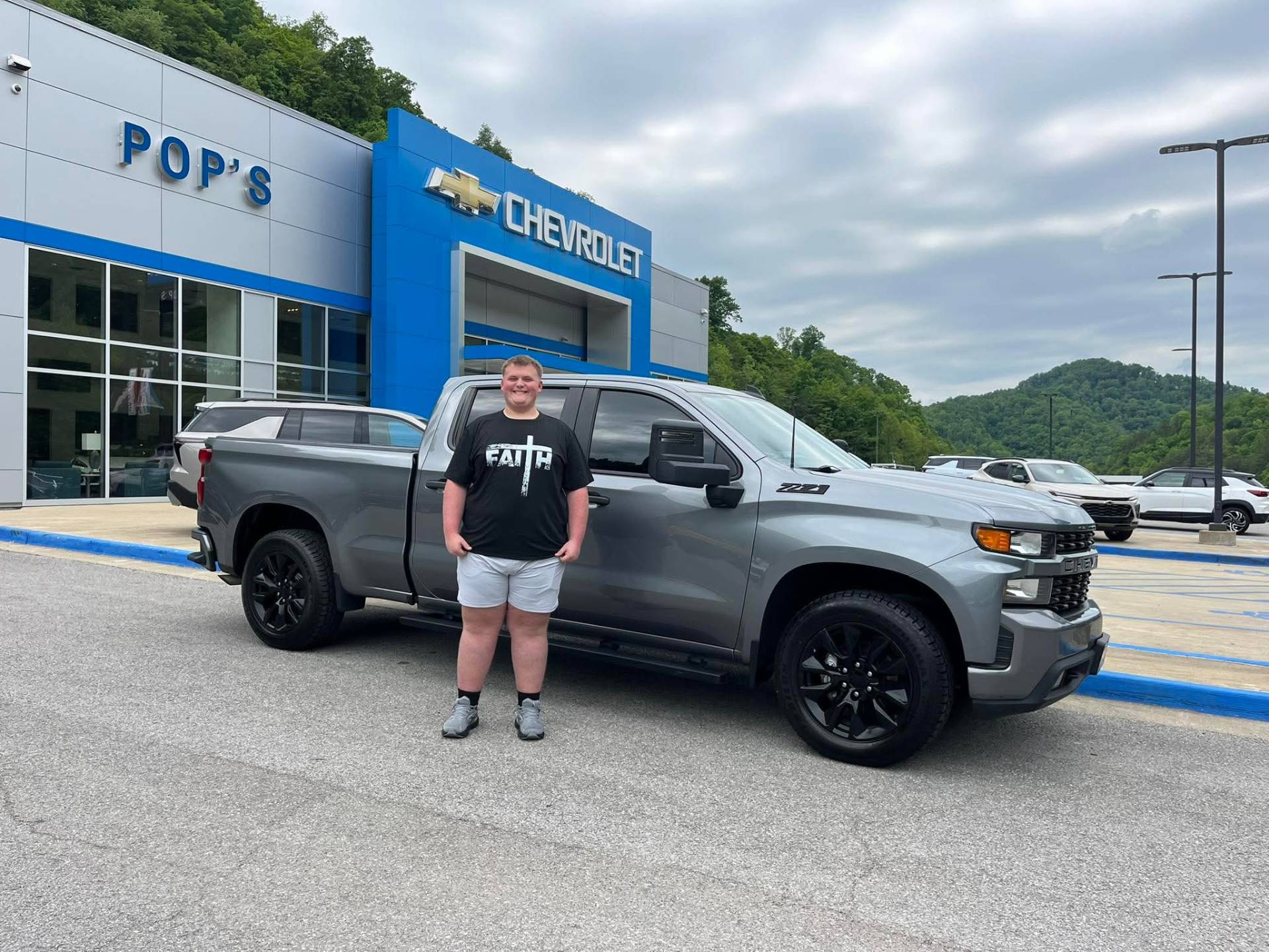 Happy customer taking delivery at Pop Chevrolet with Nathan Hall